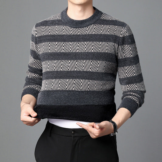 Man wearing a black and grey stripe knit crewneck sweater with chevron pattern.