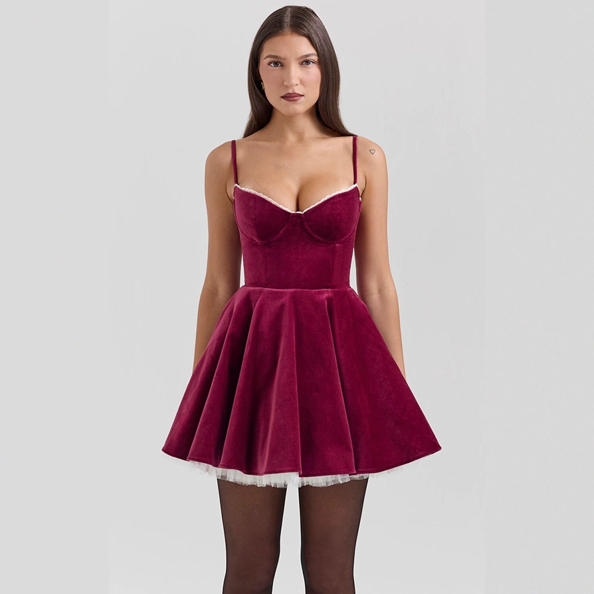 Burgundy spaghetti strap mini dress with sweetheart neckline and fit-and-flare silhouette on a hanger. 