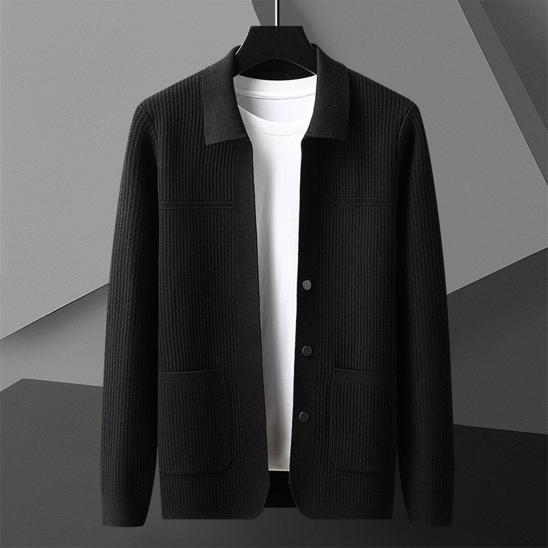 Black men’s textured knit cardigan jacket with button front and pockets on hanger.