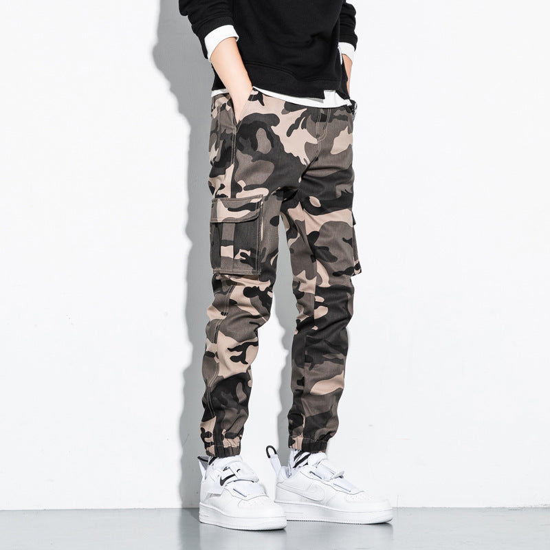 Men’s camouflage cargo jogger pants with multiple utility pockets and elastic ankle cuffs. 