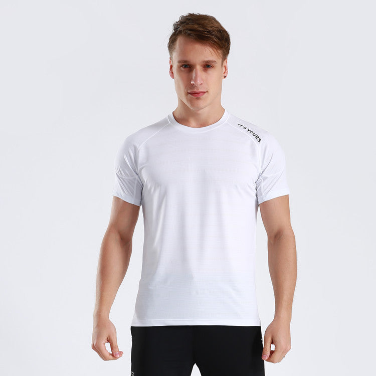 Man wearing white slim fit athletic t-shirt designed for gym with a black writing “it’s yours” on left shoulder. 
