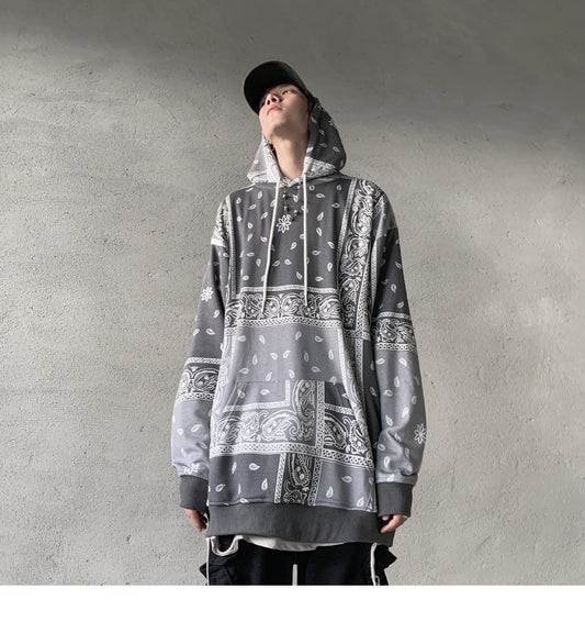 Grey oversized hoodie with all-over bandana paisley patchwork print. 