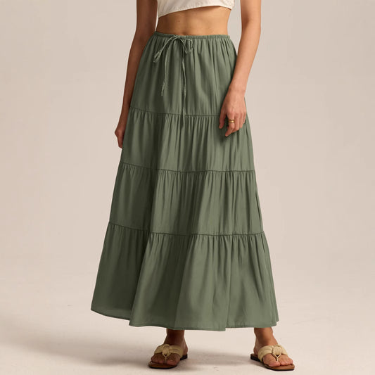 High-waisted olive green boho style maxi skirt with drawstring waist on a white background.