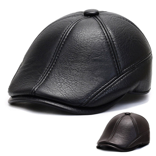 Black leather newsboy cap with eight-panel stitched design, small top button, curved short brim, and smooth 
grain texture viewed from front angle on white background.