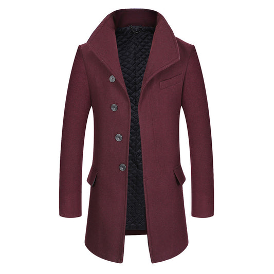 Burgundy men’s wool overcoat with stand collar, button front, and quilted inner lining. 