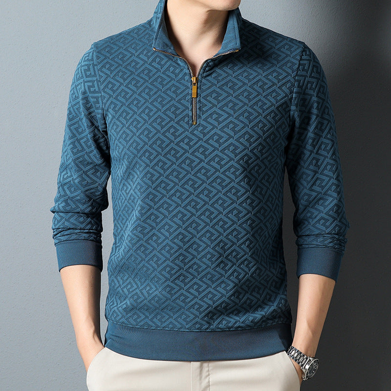 Man wearing a black textured quarter zip pullover with long sleeves and mock collar.