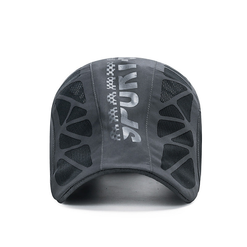 Black sports cycling cap with long curved brim, reflective SPORT lettering, and mesh ventilation panels on 
the top and sides, displayed on white background. 