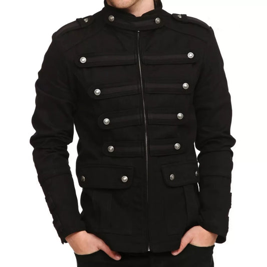  Man wearing a black military-style zip-up jacket with decorative buttons and high collar.
