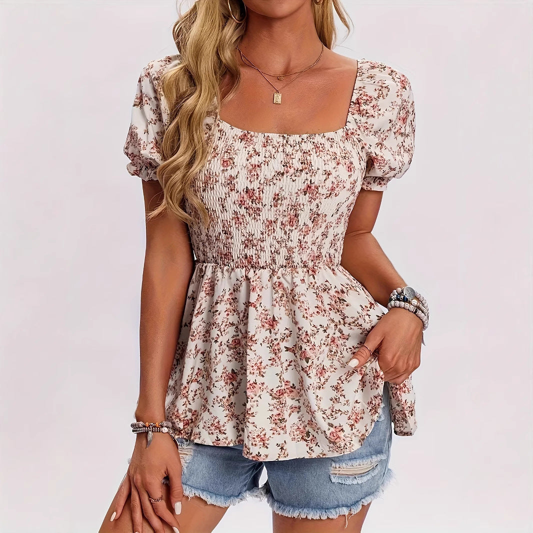 Woman wearing a black sheer mesh diagonal cut-out short sleeve bodysuit paired with blue jeans.
