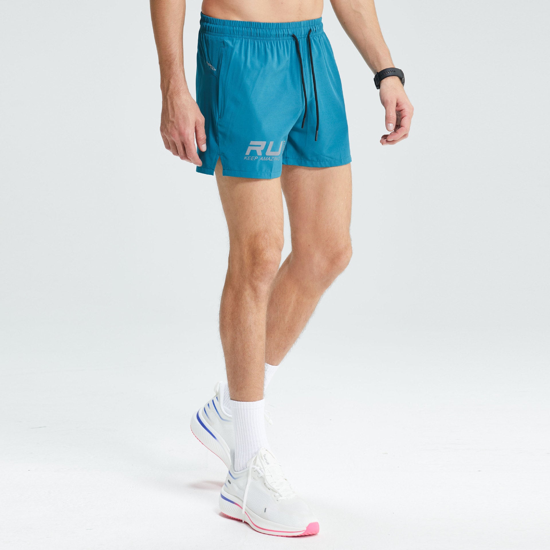 Olive green men’s athletic running shorts with elastic drawstring waistband. 