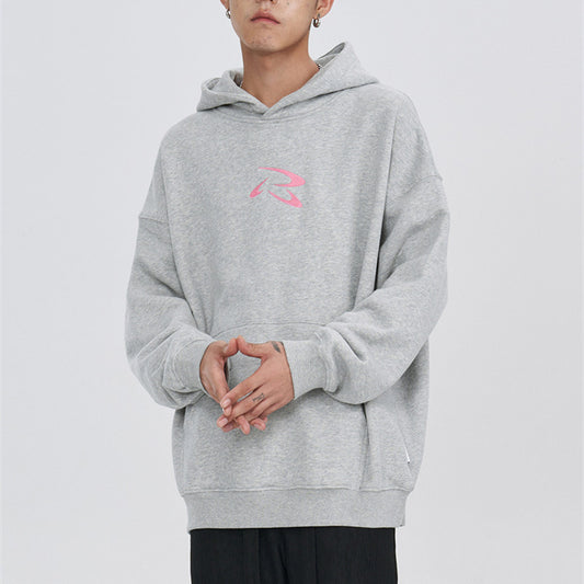 Oversized grey hoodie with pink abstract graphic on back and small front logo.