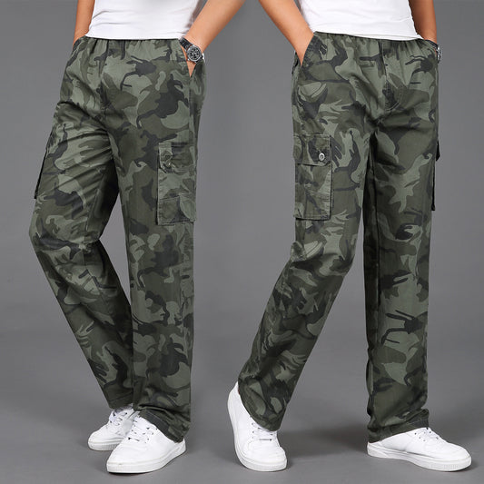 Man wearing army green camouflage cargo pants with multiple flap pockets and white sneakers, styled for 
military-inspired streetwear. 