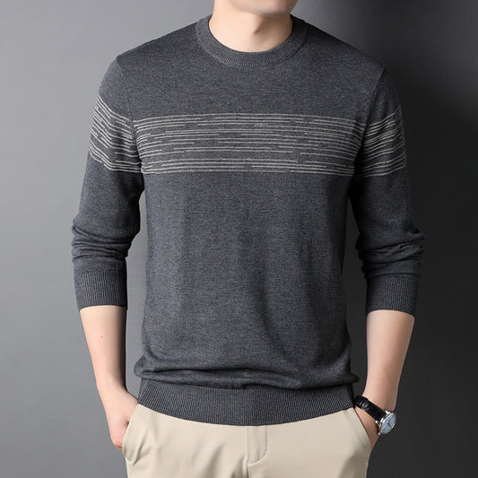 Man wearing a beige ribbed knit crewneck sweater with subtle horizontal chest stripe detail and long 
sleeves.