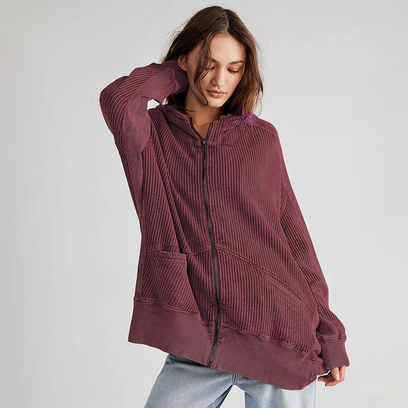 Brown waffle knit zip-up hoodie with hood, front zipper, and pockets. 