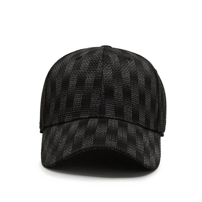 Black textured baseball cap with a curved brim and structured crown on a white background. 