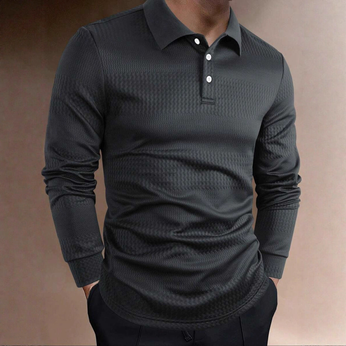 Men wearing a charcoal gray long sleeve polo shirt with textured fabric and button collar in a slim fit design. 