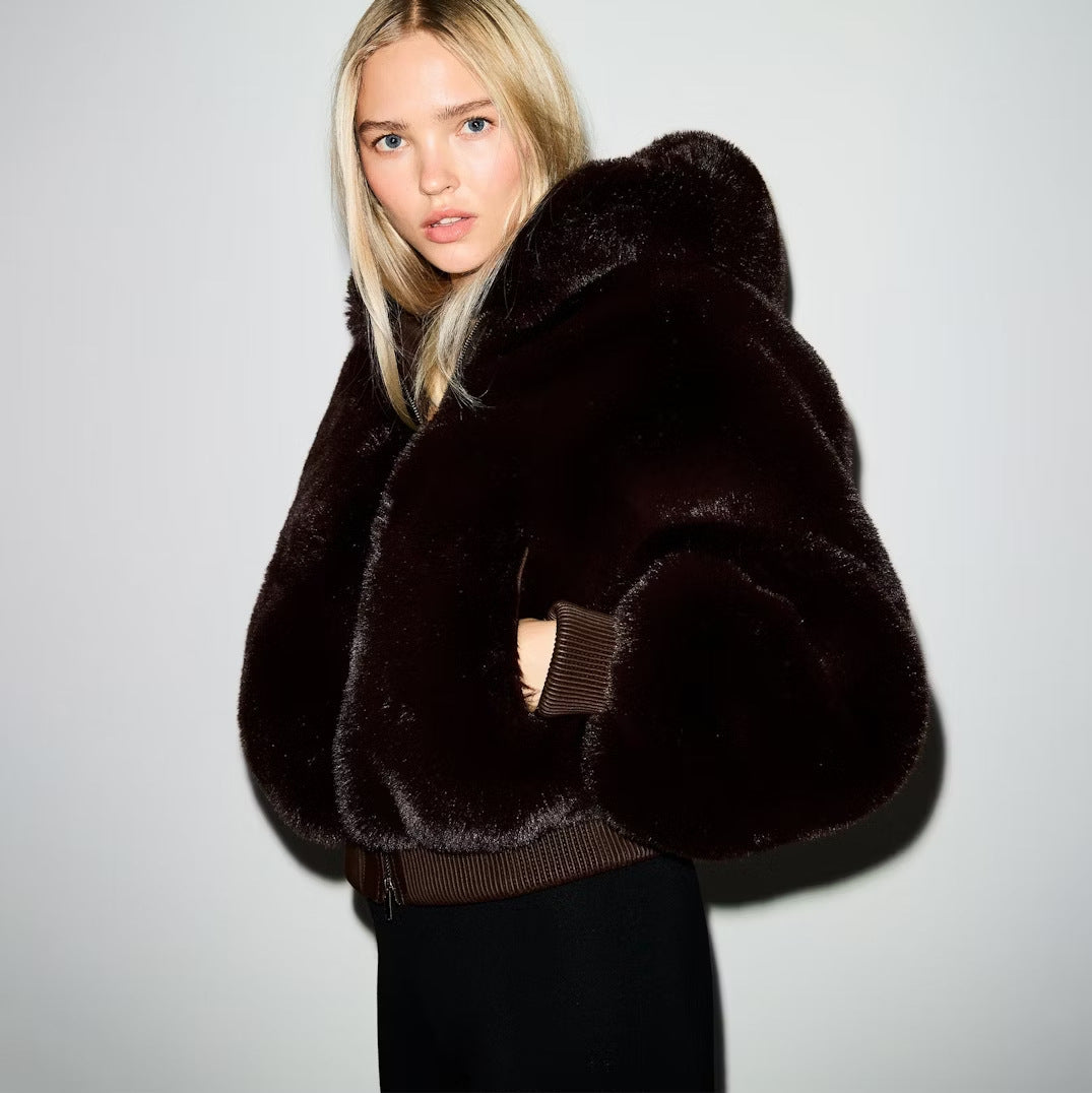 Brown faux fur hooded cropped jacket with zip-up front and ribbed cuffs.
