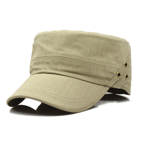 Light khaki cadet cap with cotton fabric, stitched crown lines, dual metal side rivets, and curved brim.