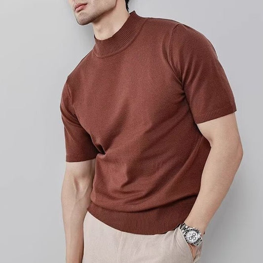 Man wearing a brown short sleeve knit mock neck top with slim fit design. 